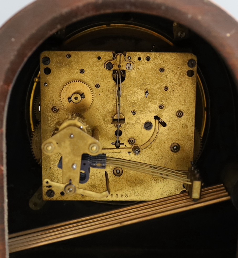 An early 20th century Goldsmiths & Silversmiths amboyna cased mantel clock, width 41cm, together with two other mantel clocks and a wall dial